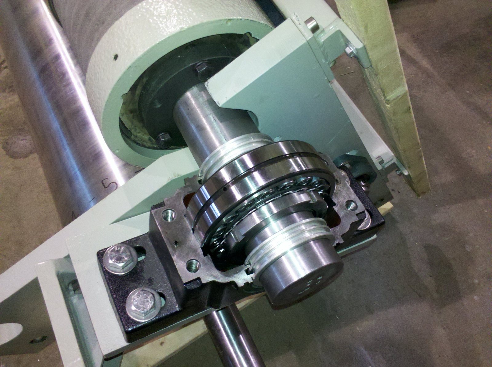 Partly assembled split pillow block with its top cap removed, exposing the bearing and shaft seals